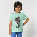 Child wearing a light aqua t-shirt with a seahorse design by fauna.ie
