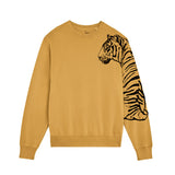 Mustard yellow sweatshirt with a tiger design on the sleeve against a white background. by fauna.ie