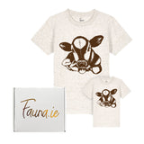 Two t-shirts with cow designs and a box labeled 'Fauna.ie' on a white background