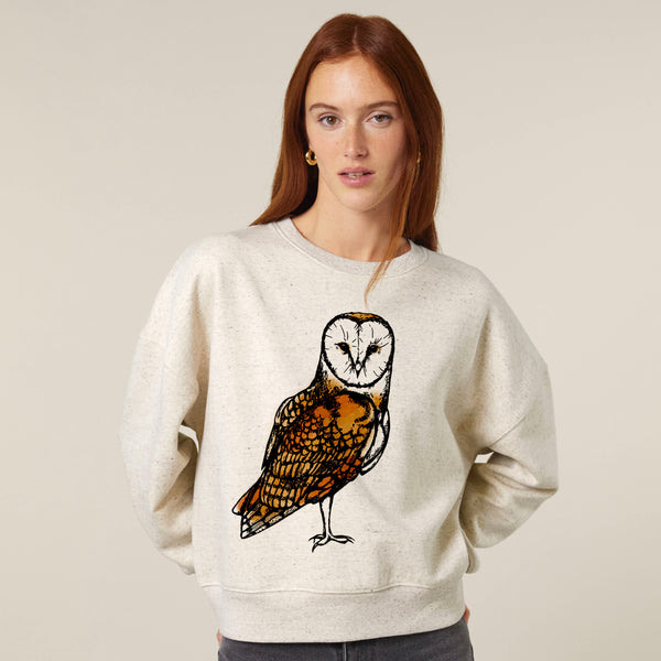 Woman wearing a sweatshirt with an owl design by fauna.ie