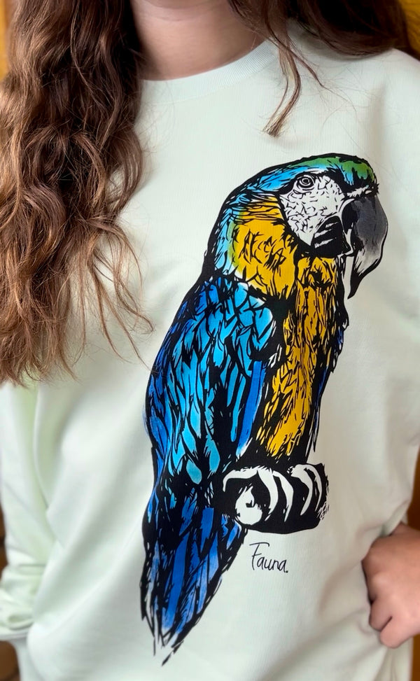 green sweatshirt with a colorful parrot design by fauna.ie