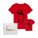 Red t-shirt with black puffin design and smaller matching t-shirt on a white background, featuring 'Fauna.ie' branding.